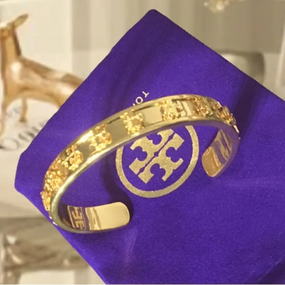 TORY BURCH RAISE LOGO STUDDED 18k GOLD PLATED BRACELET
